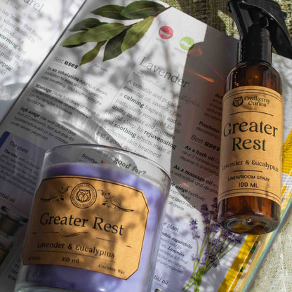 Two 'Greater Rest' products on an open book with a textured surface background