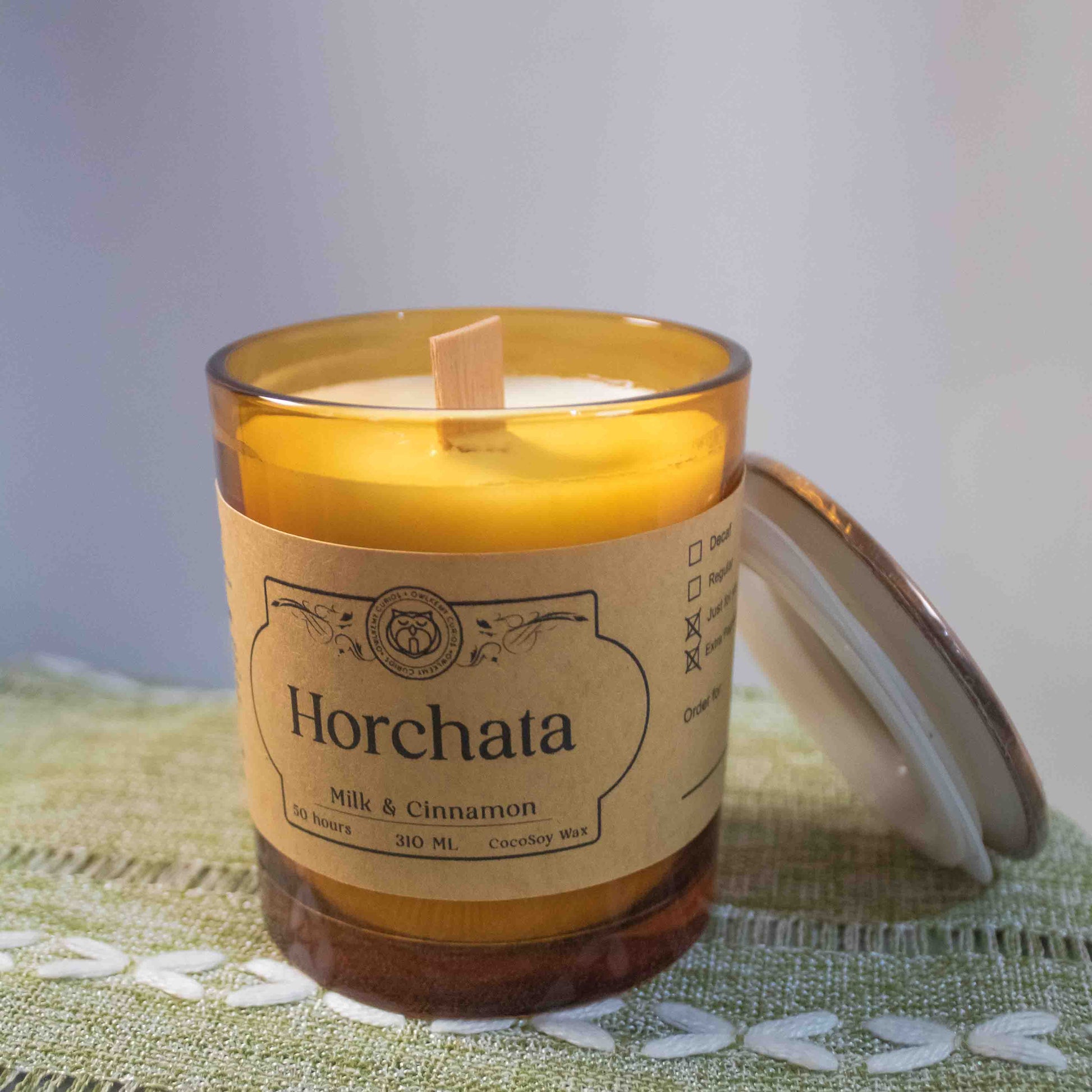 Horchata candle with a label on a textured surface