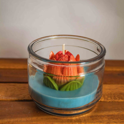 Decorative candle in a glass jar with a white background
