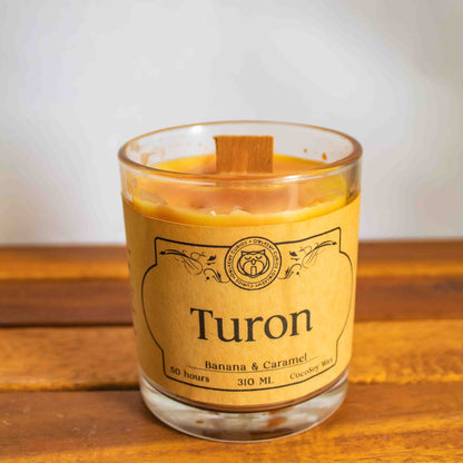 Turon candle with a label on a wooden surface